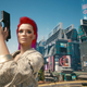 My character in CD Projekt Red's Cyberpunk 2077 has short pink hair, is holding a gun, and wearing a snakeskin blazer in this screenshot from the game.
